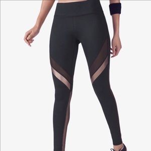 Fabletics Mid-Rise Powerhold Mesh Leggings in Black & Copper